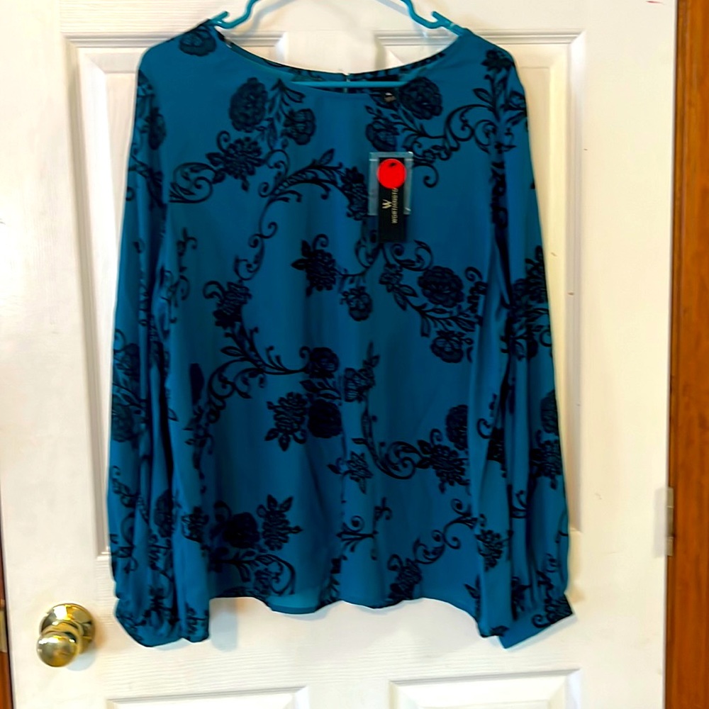 Never worn. Woman’s blouse.